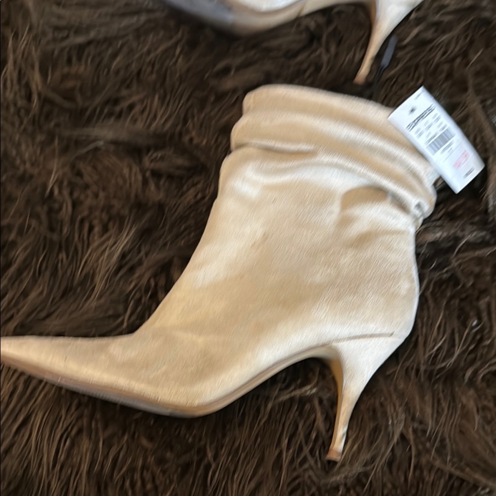 Cream Heeled Boots with Pointed Toe and Slouchy Design